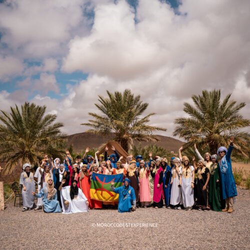 students trying moroccan traditional clothes