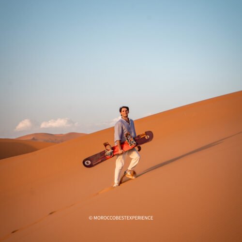 sandboarding the dunes while watching the sunset